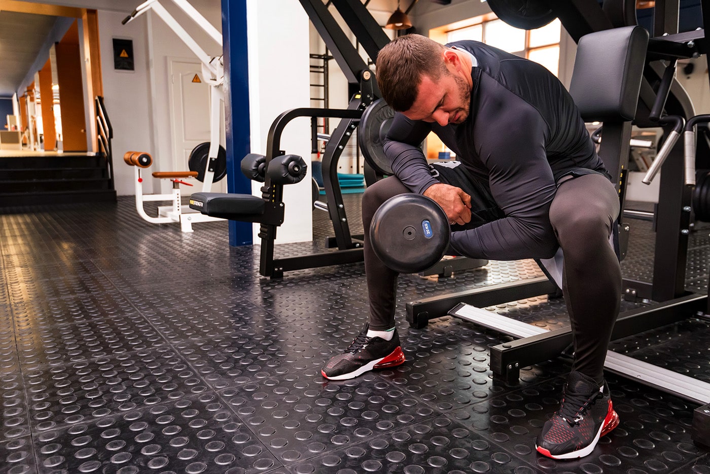 male-athlete-doing-biceps-exercise-with-dumbbells-X32HPD6-min.jpg